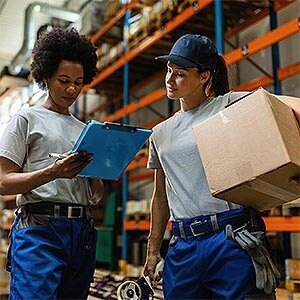 Warehouse workers checking shipment