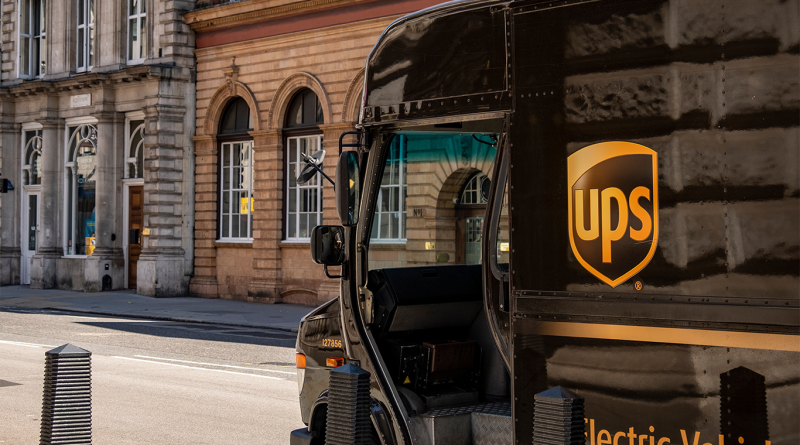 UPS van driving down a busy road to support shipping costs article