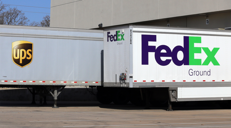 Fedex and UPS trucks parked next to each other