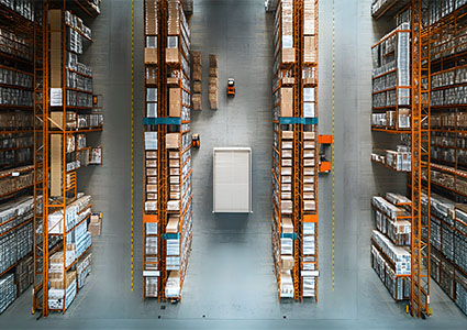 Aerial View of a Warehouse with Forklifts Moving Goods