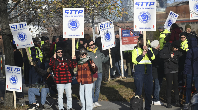 People protesting with protest boards to support Canada Post strike article