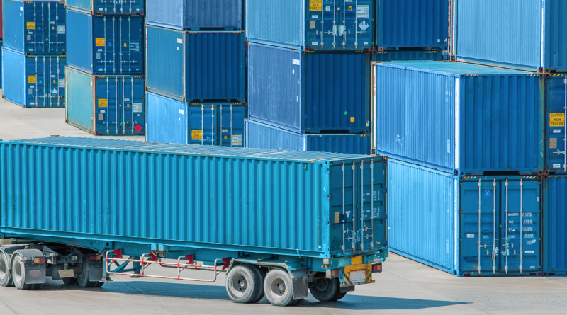 An image of a freight truck with a lock symbol overlay, representing cargo theft prevention in logistics.