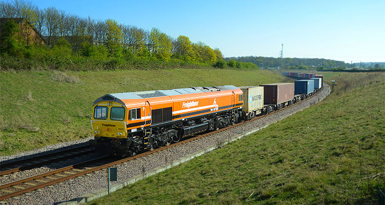 Freightliner Class 66 locomotive 66501, adorned with special branding to commemorate the 60th Anniversary of Freightliner operations