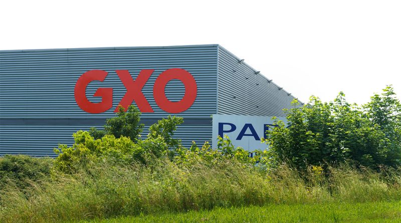 GXO posts 16% rise in profit on strong organic growth A GXO Logistics warehouse with automated systems and staff in motion, representing growth in logistics operations and strategic expansion