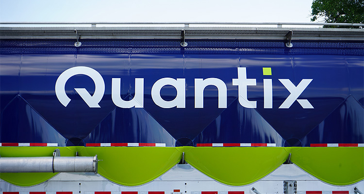 How Quantix is redefining supply chain solutions across the chemical sector logo and name "Quantix" on the side of a large vehicle or trailer