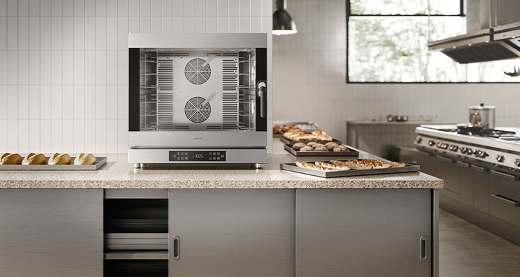 kitchen setting featuring a Smeg convection oven on a marble countertop