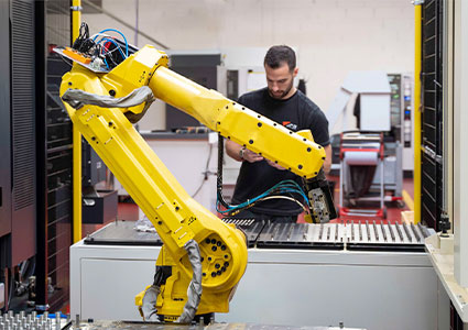 a yellow FANUC industrial robot