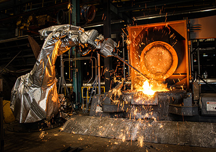 an Inductotherm Automated Robotic Melt Shop (ARMS) system performing hazardous operations in a foundry