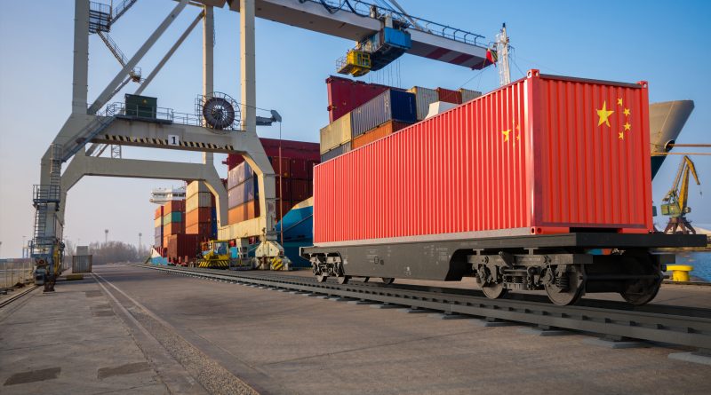 Shipping containers at a major US port as rising import prices from China increase costs for manufacturers and logistics providers.
