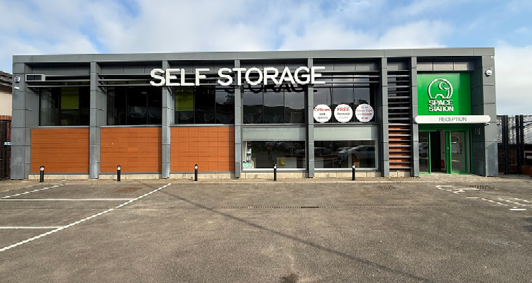 Under new ownership, Space Station has expanded steadily, upgrading legacy sites and developing new stores the exterior storefront of a modern commercial storage facility during the day.