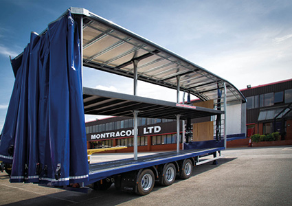 a Montracon Double Deck Curtainsider semi-trailer with a blue curtain-sided body